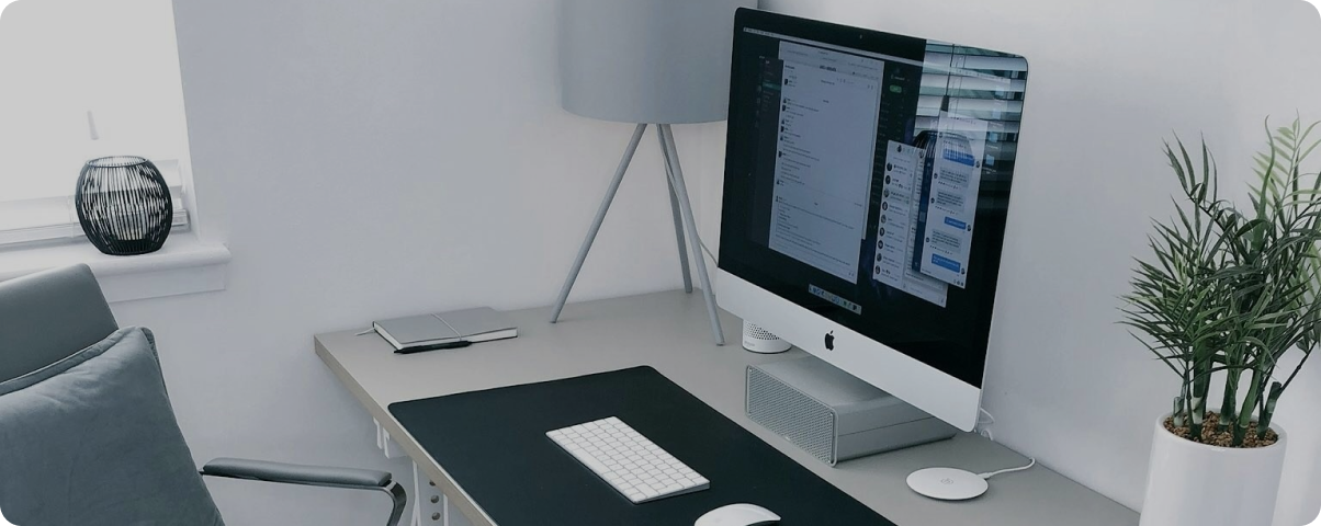 Two people discussing over something on their laptops